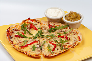 Italian pizza Tortilla with grated Mozzarella