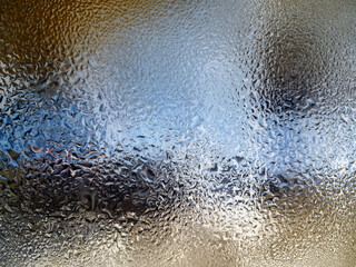 frosty patterns on the window glass closeup. natural textures and backgrounds. ice patterns on frozen