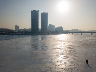 Melting Dnieper River in spring Kiev. Ice crack on the river. Aerial drone view. Spring sunny...