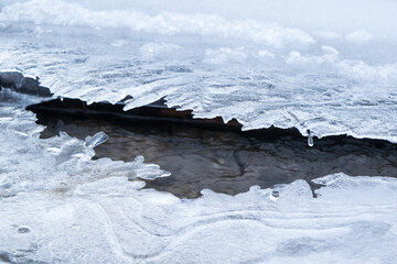 Water flowing under ice © Matej