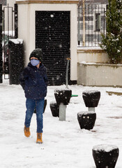 A boy walking in the snow