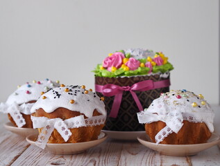 Easter treat.Painted eggs and Easter cakes, anointed with cream and decorated with a ribbon bow