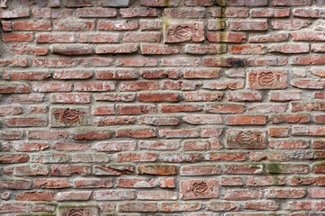 Brick wall of unplastered old brick chimney