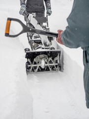 Clearing snow with a snowblower