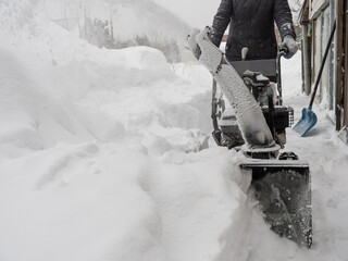 Clearing snow with a snowblower