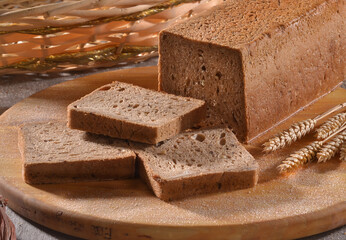 toast wheat integral bread sliced on rustic background.