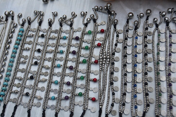 silver bracelets and charms