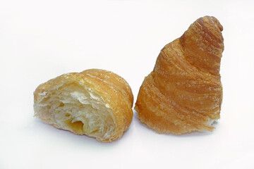 Half croissant on a white background. A bitten croissant with a filling.