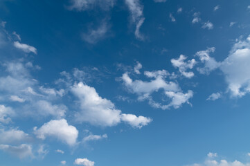 Naklejka na ściany i meble clouds soaring in the blue sky 
