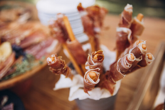 Wedding buffet. Snacks and fruits on a wooden table
