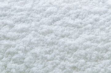 winter background: fresh clean even snow, large snowflakes