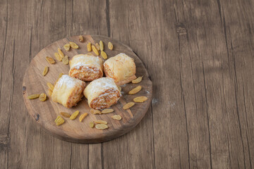 Crispy cooked roll cookies with stuffing on a wooden board