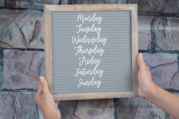 Name of weekdays embedded on grey background