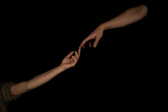 Man And Woman Holding Hands Isolated On Black Background.