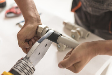 Man keep soldering iron for polypropylene