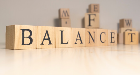 The word balance is from wooden cubes. Background from wooden letters.