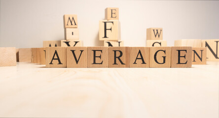 The word Average is from wooden cubes. Background from wooden letters.