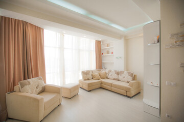 The interior of a modern apartment after renovation. Presentation of the apartment in light warm tones