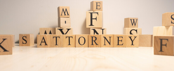 The word Attorney is from wooden cubes. Background from wooden letters.