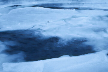 blue river in winter long exposure