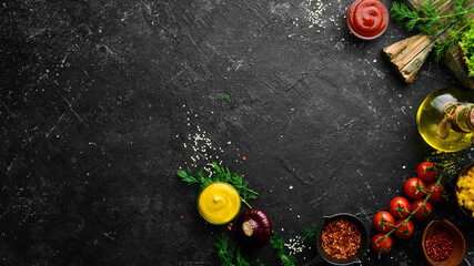 Kitchen background. Cooking sandwiches and street food: sauces, spices and ingredients. Top view....