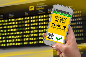 Smartphone with international certificate of vaccination against covid-19 with airport background