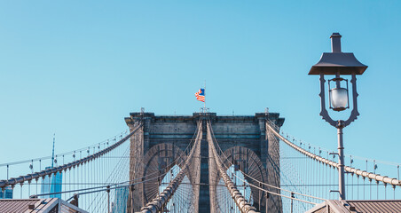 Fototapeta premium View from the pedestrian walkway of the Brooklyn Bridge. The Brooklyn Bridge is connects the boroughs of Manhattan and Brooklyn and is one of the biggest suspension bridge in the world.