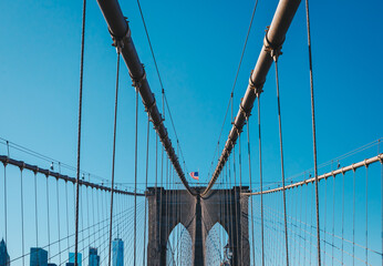 Obraz premium View from the pedestrian walkway of the Brooklyn Bridge. The Brooklyn Bridge is connects the boroughs of Manhattan and Brooklyn and is one of the biggest suspension bridge in the world.
