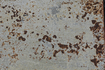 Old broken sanded aged painted facade of rusty smudged daub grime. Rough edges wrinkled plaster of uneven wall. Cracked chipped messy falling stucco. Dirty vintage flaking textured layer for 3D design