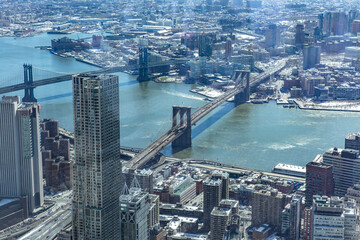 Obraz premium Aerial view of New York City with Manhattan skyscrapers and streets and Manhattan and Brooklyn bridge