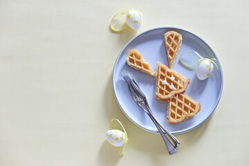 Easter bunny waffles. Festive Easter breakfast ideas. Flat layot, selective focus