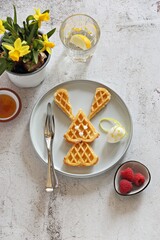 Easter bunny waffles. Festive Easter breakfast ideas. Flat layot, selective focus