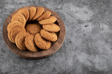 Close up photo of fresh homemade cookies. Delicious cookies on wooden tray