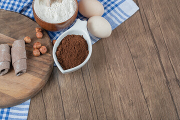 Caucasian mutaki wrap cookies with cinnamon on a wooden board