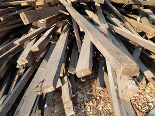 A pile of logs from dismantling the house.