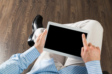 businessman with a tablet, works in the office