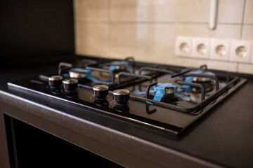 renovation of the kitchen. new gas stove on the background of a light wall