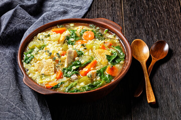 chicken kale veggies soup in a bowl