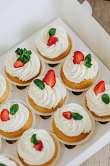 Cupcakes with strawberries and blueberries. Selective focus.