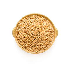 Dry orgaic brown wheat seed pile in ceramic bowl on white background