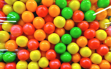 Tempting colorful confectionery in a glass jar. Sweet candies.