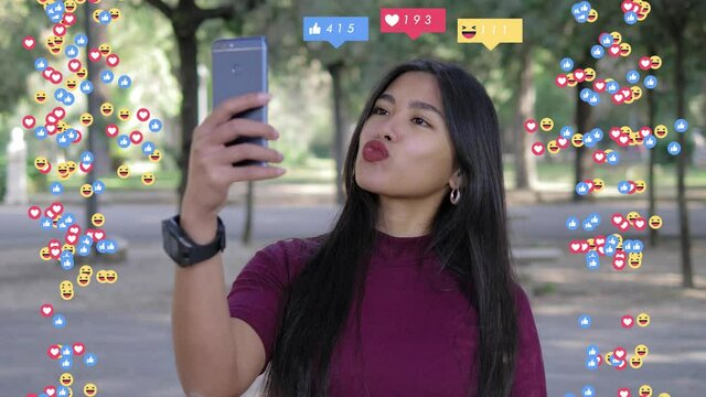 globalization, social media - asian girl takes a selfie making grimaces