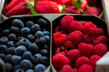 Delicious and healthy box of strawberries, blueberries and raspberries