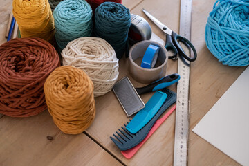 Tools and skeins of colorful threads for creating macrame with your own hands. Lesson, master...