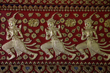 Devas sculpted on a wall of Wat Suandok pagoda, Chiang Mai. Thailand. 25.02.2017