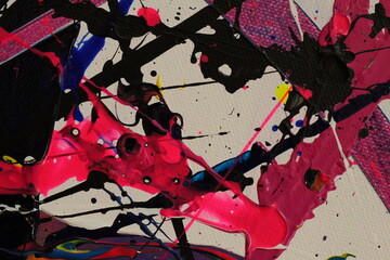 Pink and black paint splatters cover a white canvas in this abstract backround.
