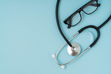 Stethoscope on blue background with a copy space.