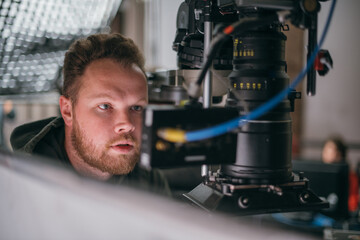 Director of photography with a camera in his hands on the set.