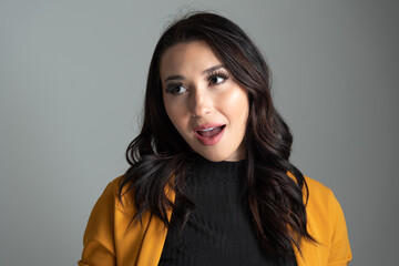 Studio headshot of beautiful young Latina business woman with room for copy.