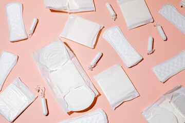 Tampons, feminine sanitary pads pattern on pink background. Hygiene care during critical days....